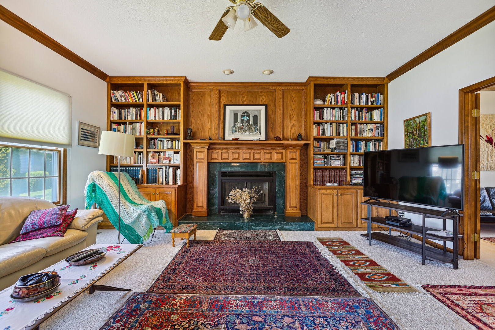 2203 Edgewater Place Champaign, IL 61822 - Photo 9 of 35 a living room with fireplace furniture and a flat screen tv