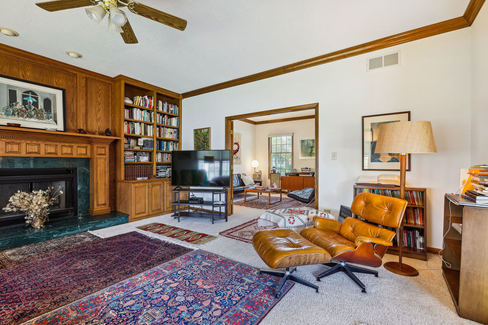 2203 Edgewater Place Champaign, IL 61822 - Photo 10 of 35 a living room with furniture a flat screen tv and a fireplace