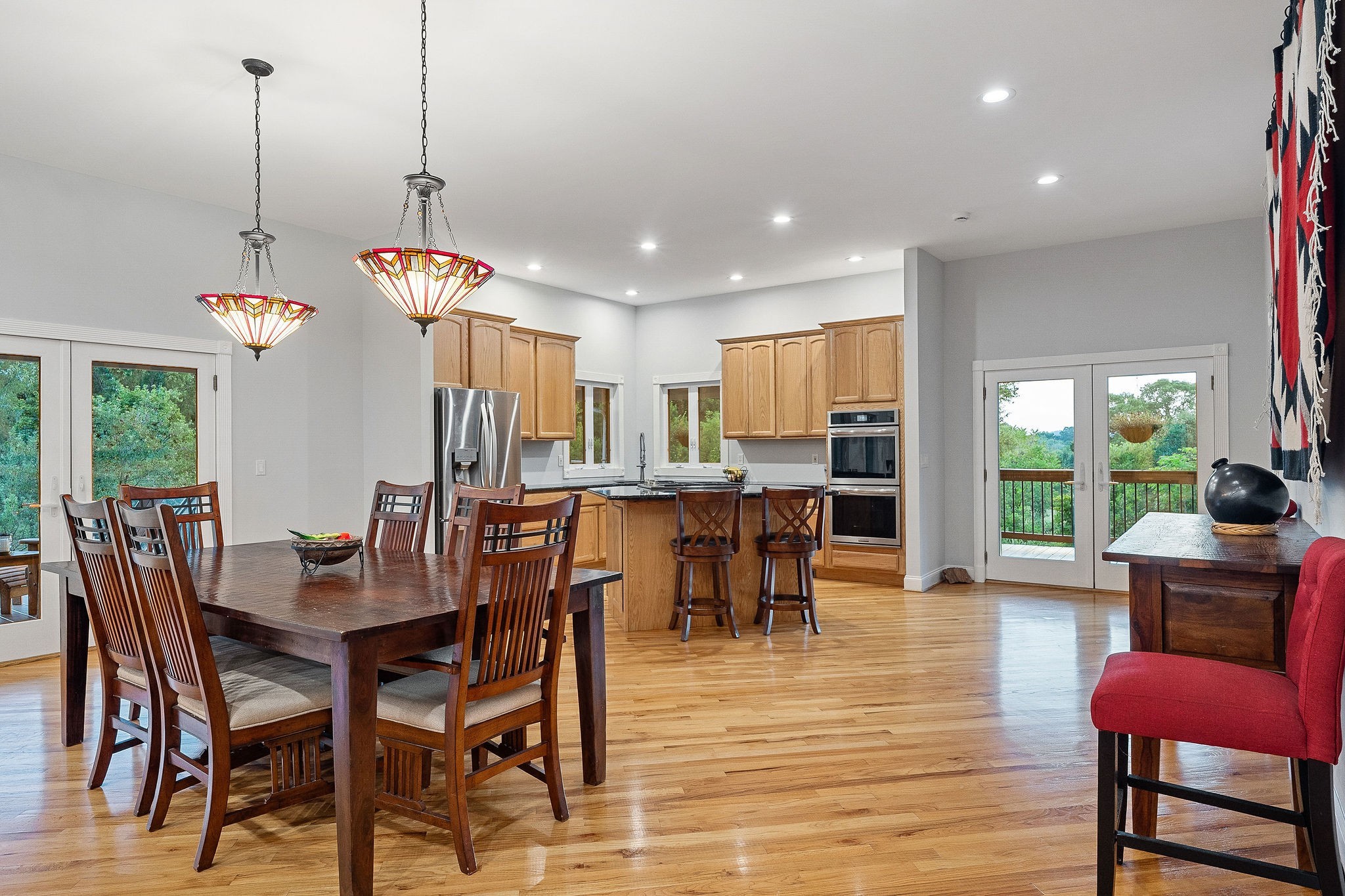 574 Hayes Ridge Road Lancaster, TN 38569 - Photo 17 of 48 a view of a dining room and livingroom with furniture wooden floor a chandelier