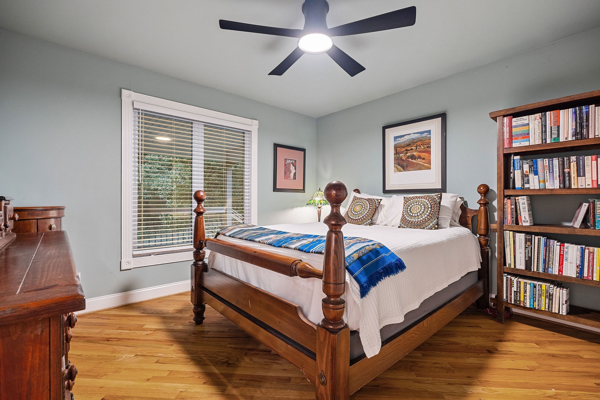 574 Hayes Ridge Road Lancaster, TN 38569 - Photo 19 of 48 a bedroom with a bed and a book shelf