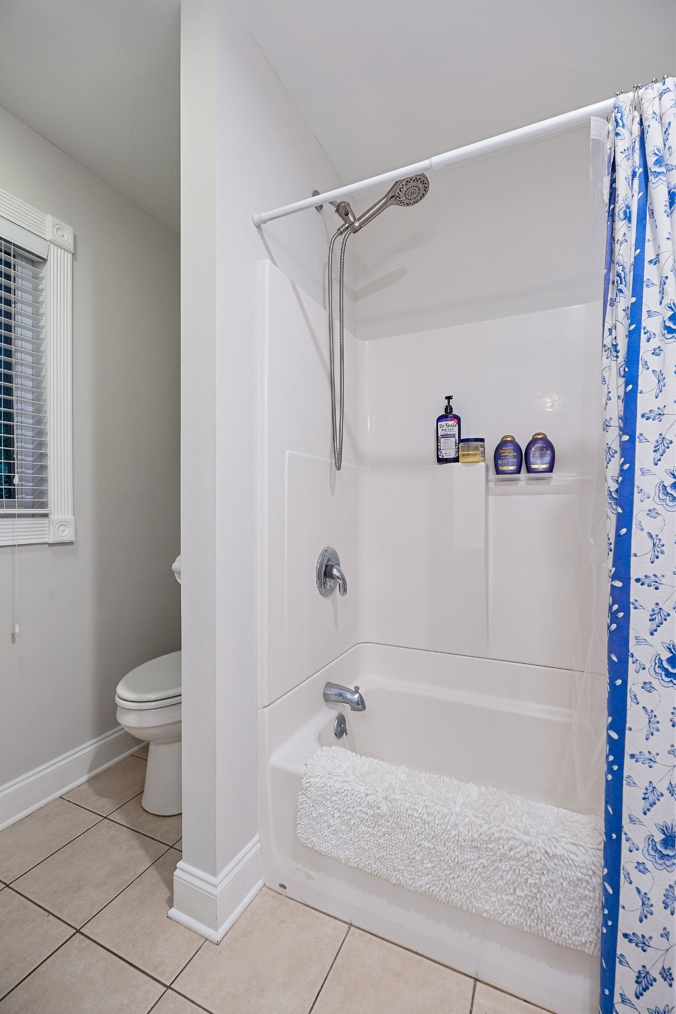 574 Hayes Ridge Road Lancaster, TN 38569 - Photo 24 of 48 a bathroom with a bathtub and a shower