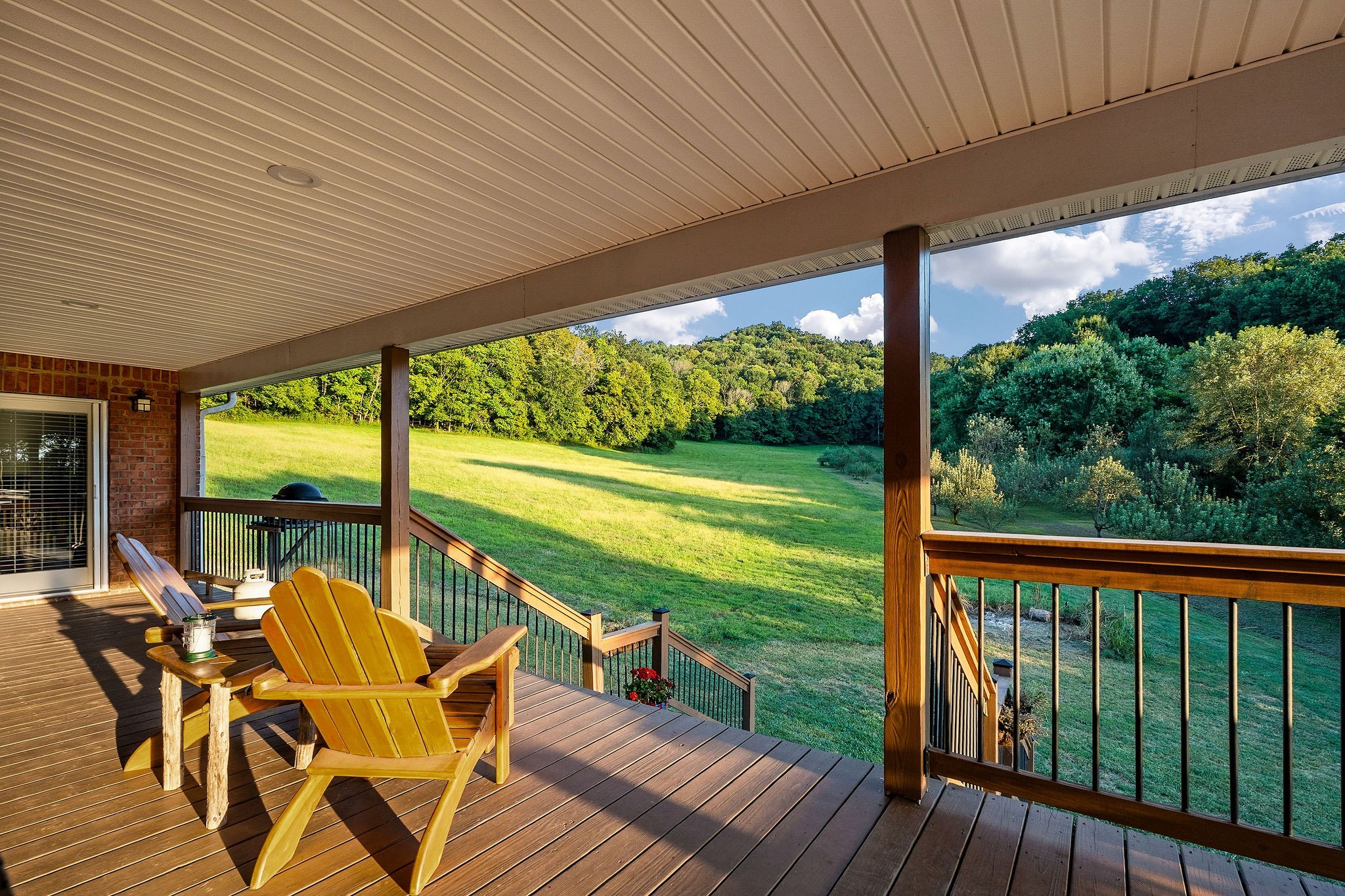 574 Hayes Ridge Road Lancaster, TN 38569 - Photo 32 of 48 a view of a patio with dining table and chairs