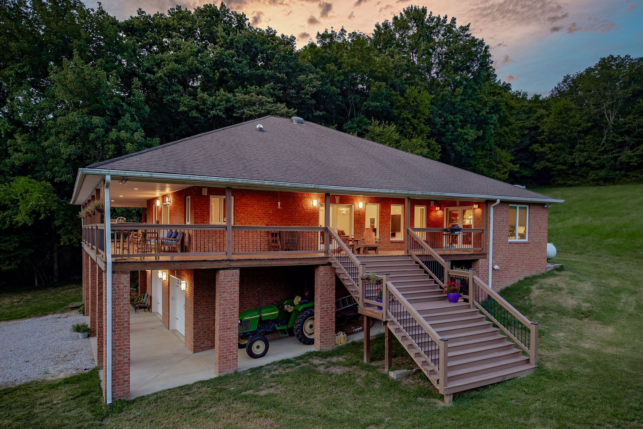 574 Hayes Ridge Road Lancaster, TN 38569 - Photo 37 of 48 a front view of a house with a yard table and chairs
