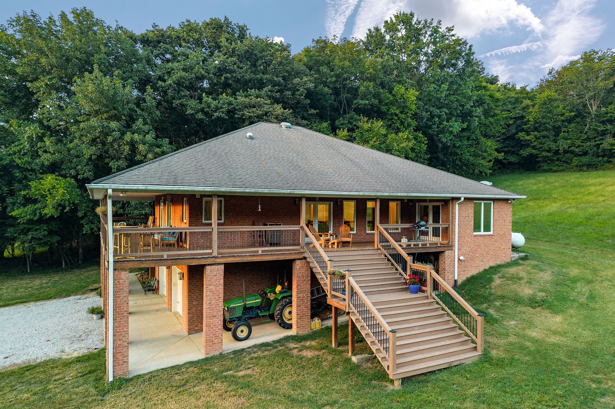 574 Hayes Ridge Road Lancaster, TN 38569 - Photo 43 of 48 a front view of a house with a yard table and chairs