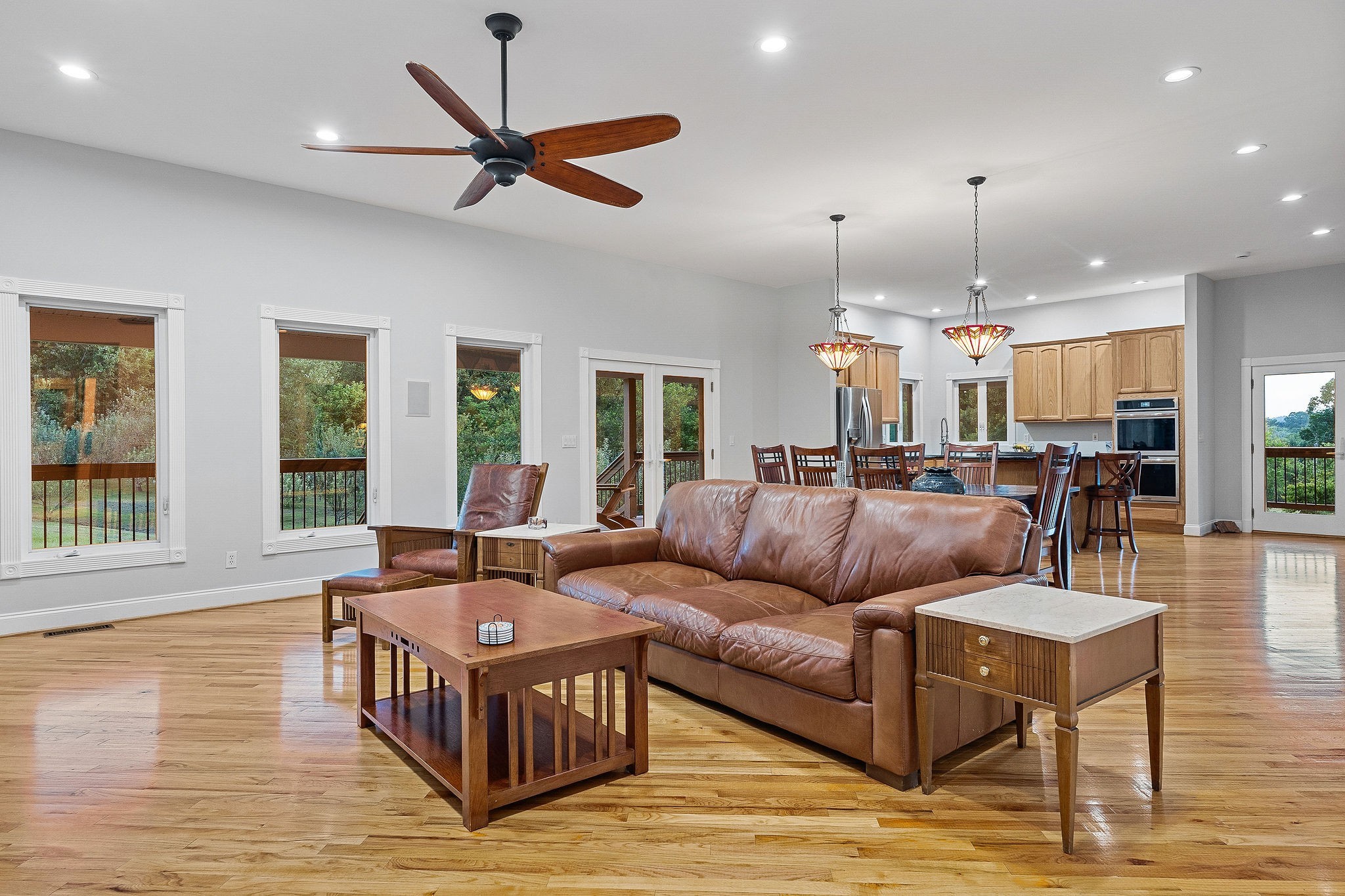 574 Hayes Ridge Road Lancaster, TN 38569 - Photo 7 of 48 a living room with furniture ceiling fan and a wooden floor