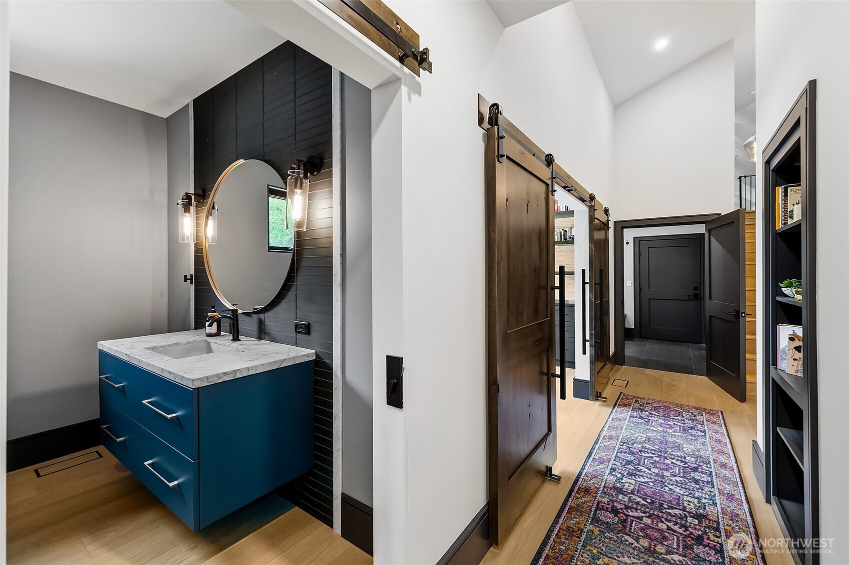 7538 Moon Valley Road Southeast North Bend, WA 98045 - Photo 25 of 40 a en suite bathroom with a sink and a mirror