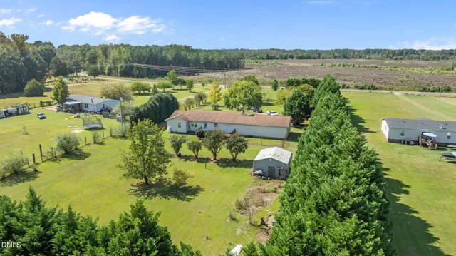 a house view with a play ground in front of it