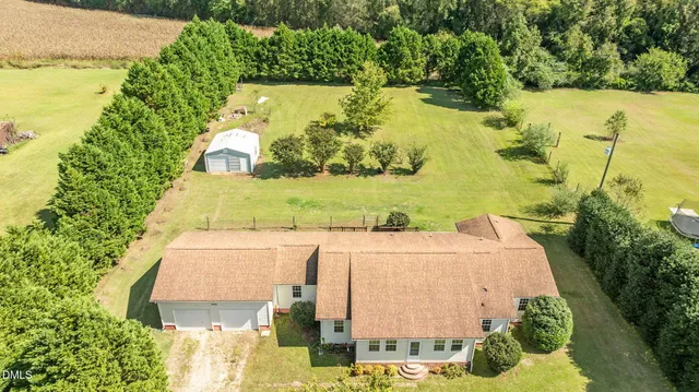 a view of a lake with houses in the back