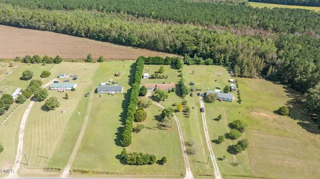 a roof deck with couches and wooden floor