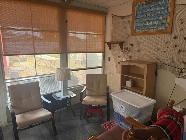 a living room with furniture a fireplace and a table