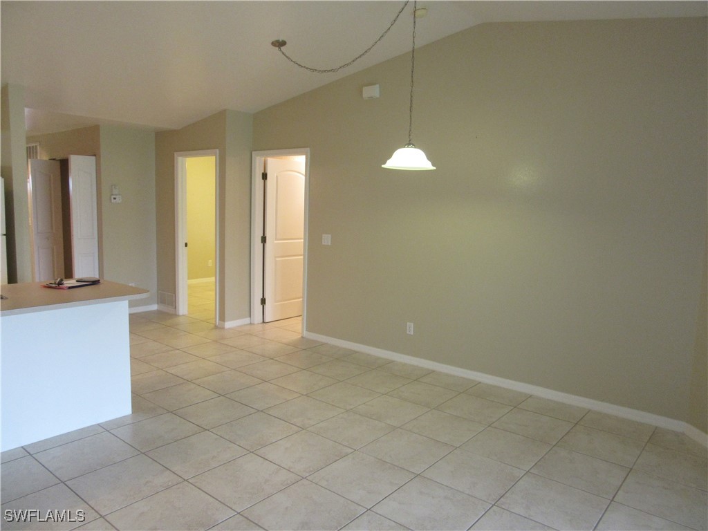 271 Southwest 4th Street, Unit 271 Cape Coral, FL 33991 - Photo 12 of 17 an empty room with windows