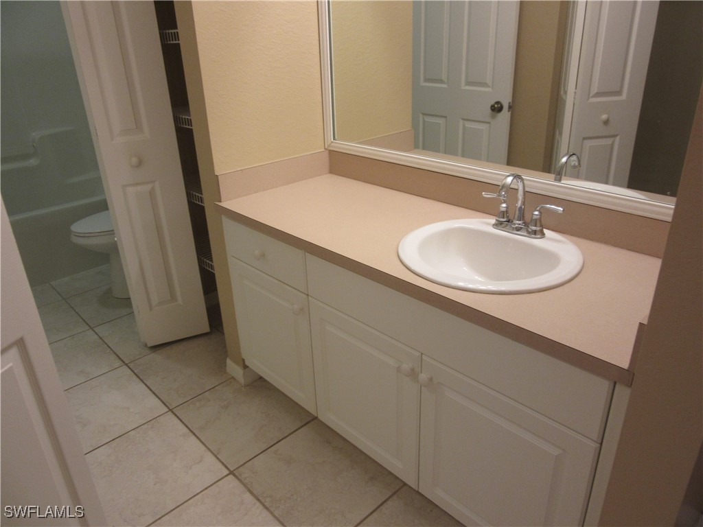 271 Southwest 4th Street, Unit 271 Cape Coral, FL 33991 - Photo 14 of 17 a bathroom with a sink and a mirror