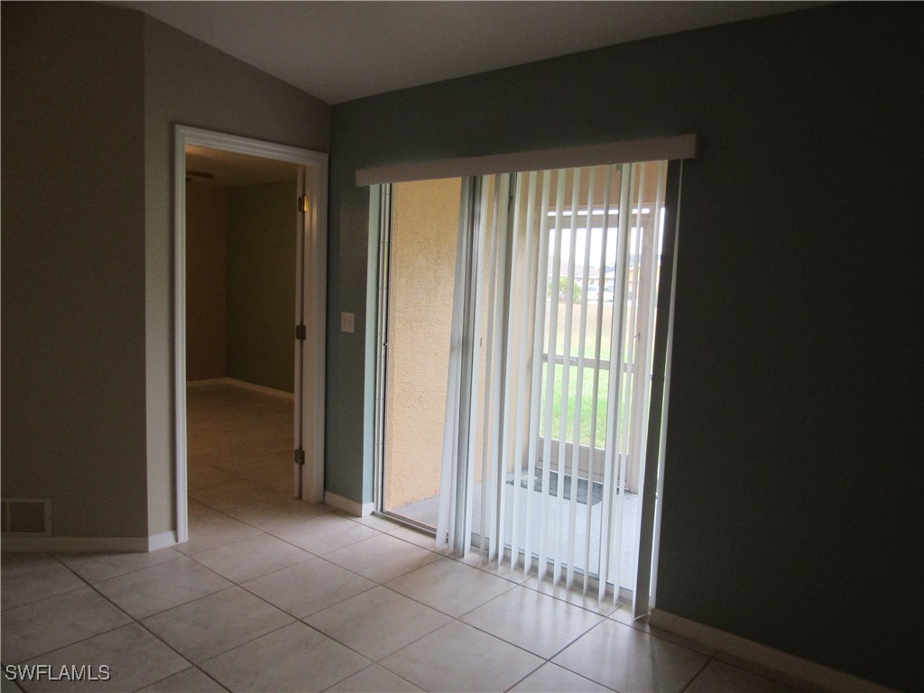 271 Southwest 4th Street, Unit 271 Cape Coral, FL 33991 - Photo 16 of 17 a view of a room that has a bed