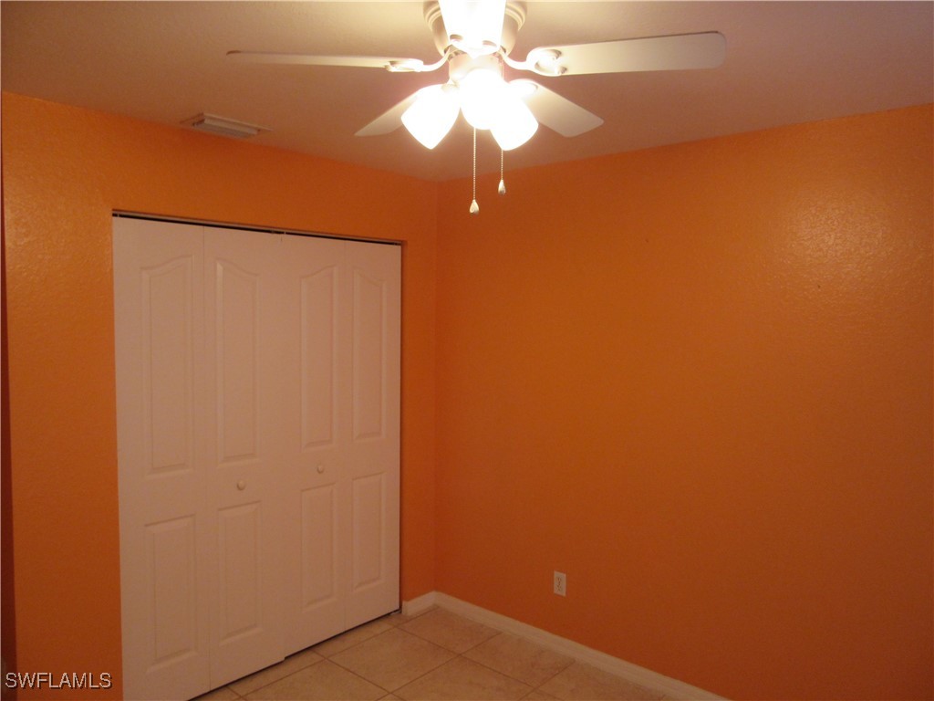 271 Southwest 4th Street, Unit 271 Cape Coral, FL 33991 - Photo 5 of 17 a view of a small space with a fan