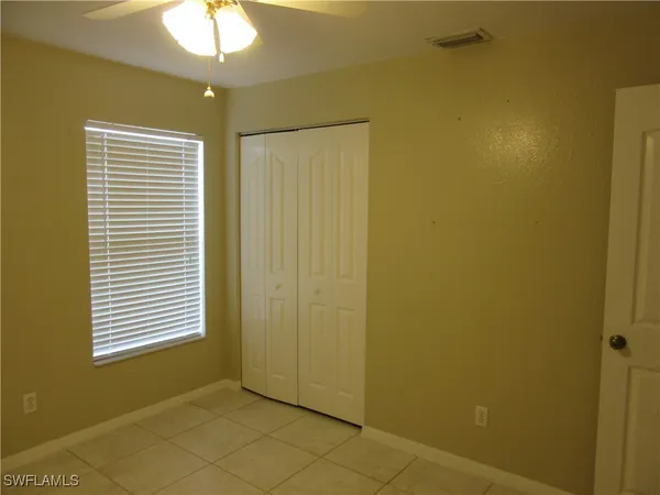 a view of a room that has a window in it