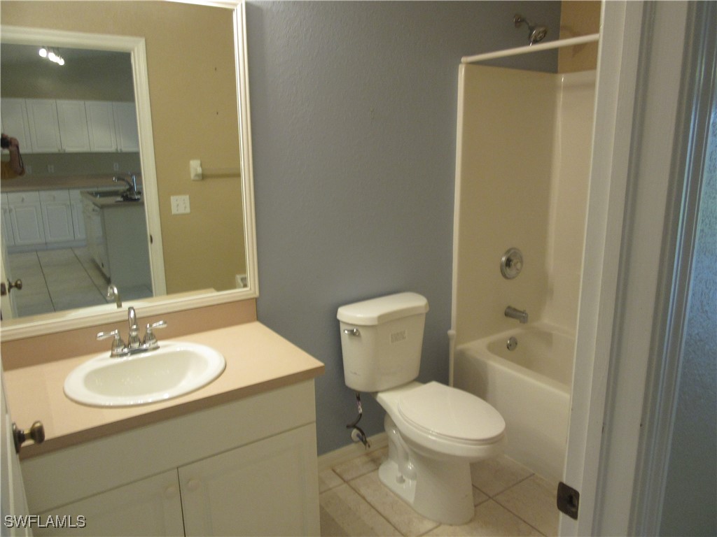 271 Southwest 4th Street, Unit 271 Cape Coral, FL 33991 - Photo 8 of 17 a bathroom with a sink toilet and shower