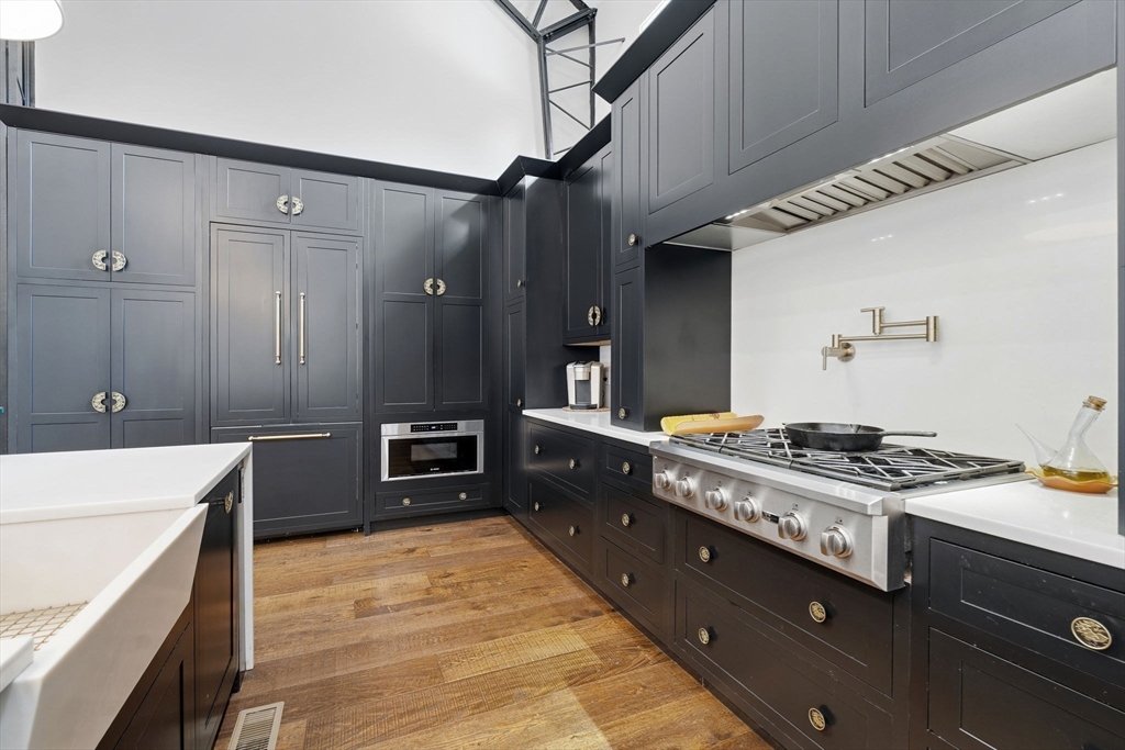 41 Myrtle Street Norfolk, MA 02056 - Photo 13 of 42 a kitchen with stainless steel appliances granite countertop a stove a sink and a refrigerator