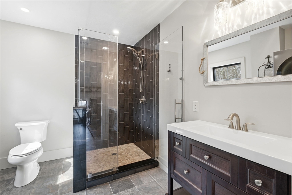 41 Myrtle Street Norfolk, MA 02056 - Photo 33 of 42 a bathroom with a sink a toilet and shower