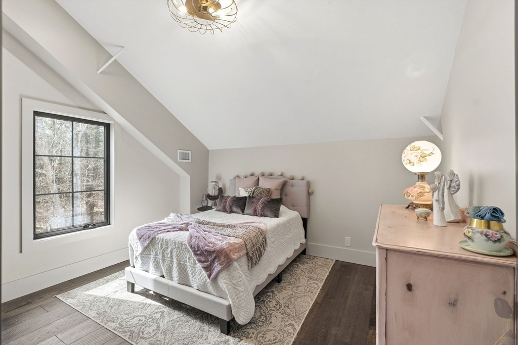 41 Myrtle Street Norfolk, MA 02056 - Photo 34 of 42 a bedroom with a bed and window