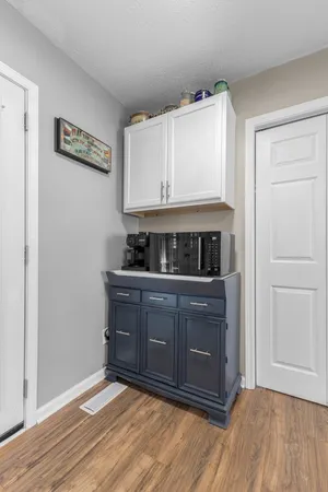 a kitchen with stainless steel appliances granite countertop a stove and a white cabinets