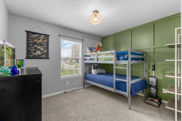 a bed room with furniture and a window