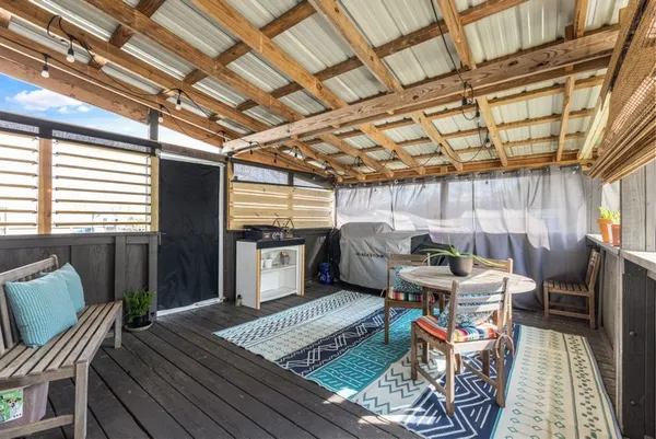 a sitting room with furniture