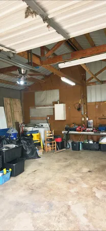 a view of a garage with parked cars
