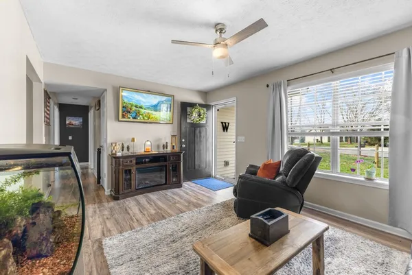 a living room with furniture and a flat screen tv