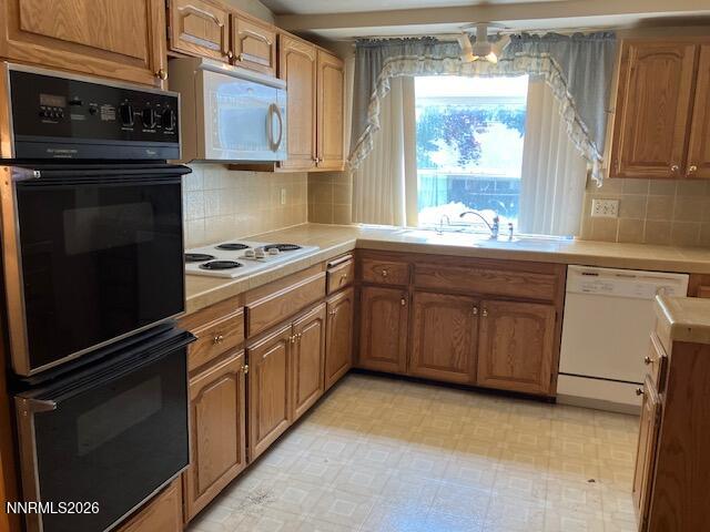 840 Meadow Springs Drive Reno, NV 89509 - Photo 5 of 23 a kitchen with granite countertop cabinets stainless steel appliances and a counter space