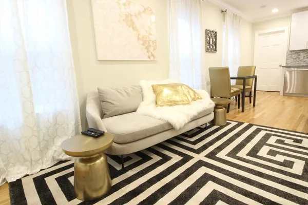 a living room with furniture and a table