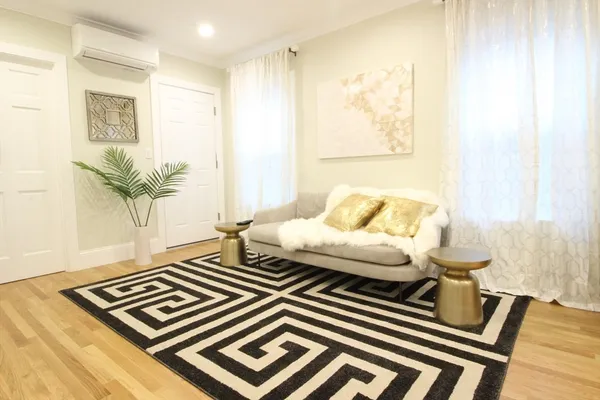 a living room with a bed and a couch