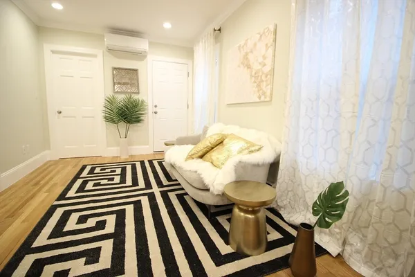 a balcony with table and chairs