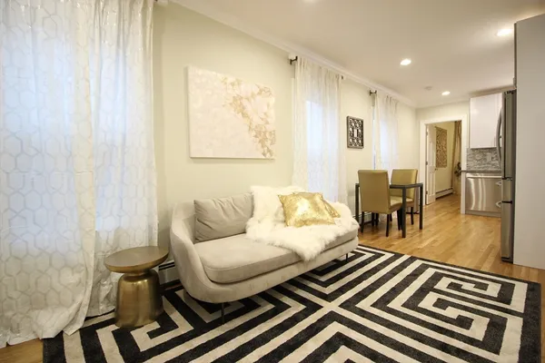 a living room with furniture and a table