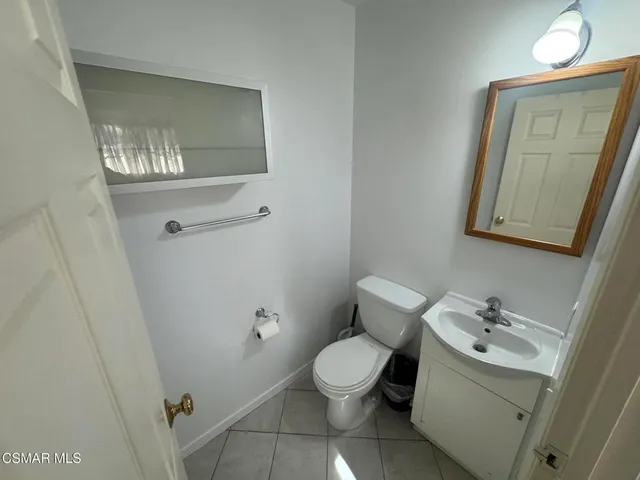 a storage room with wooden floor and utility