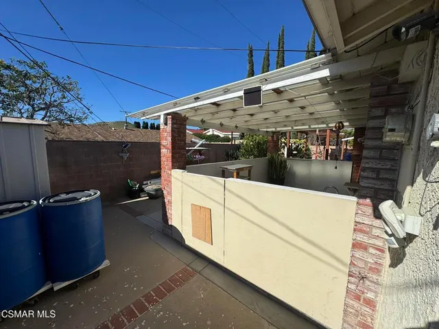 a view of a porch with seating space