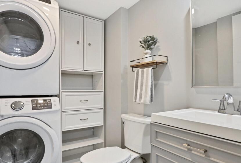 2117 21st Court Jupiter, FL 33477 - Photo 7 of 10 a bathroom with a toilet and a sink