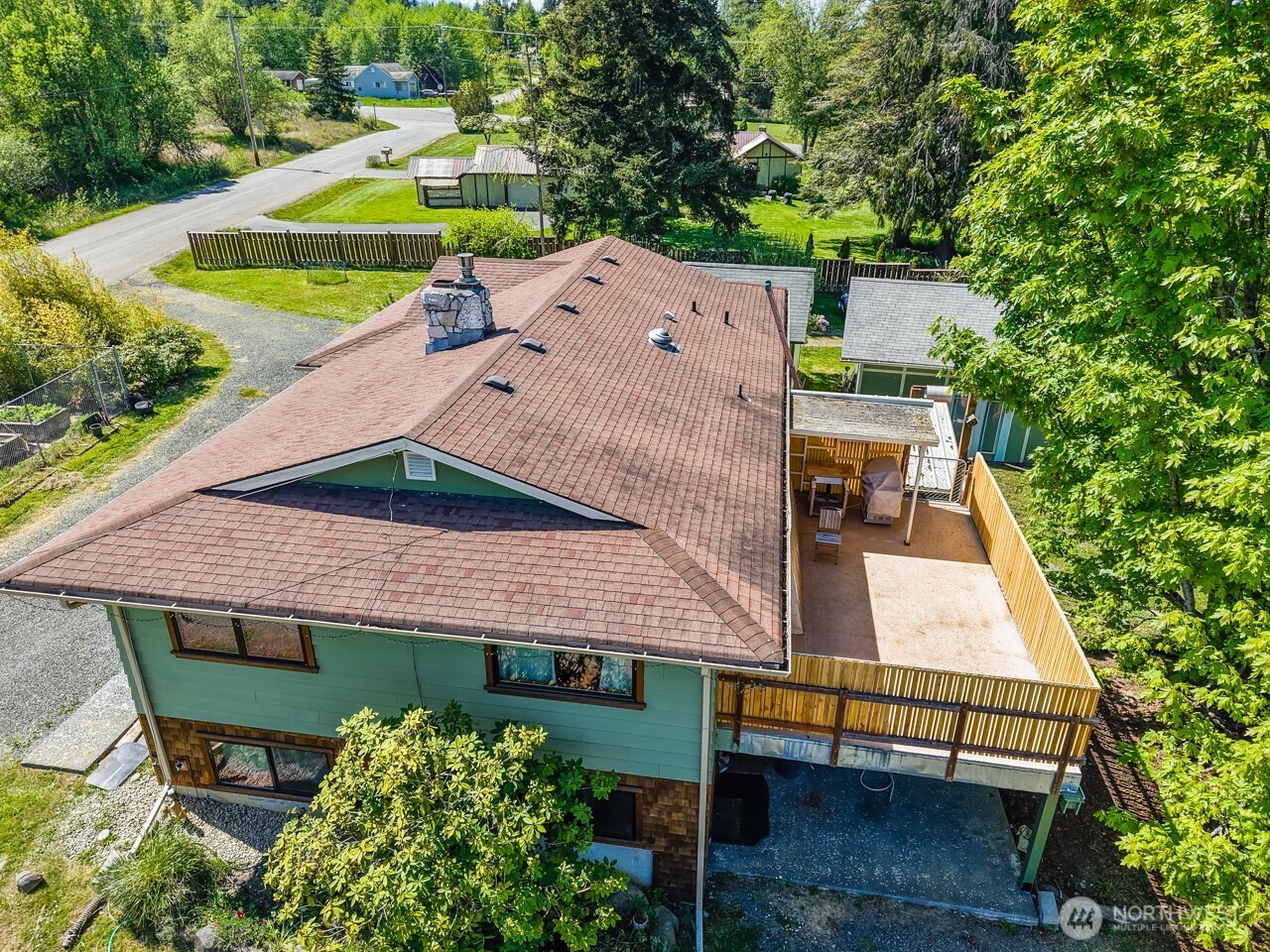 63 East Arnette Road Port Angeles, WA 98362 - Photo 4 of 40 an aerial view of a house with swimming pool and glass top table and chairs