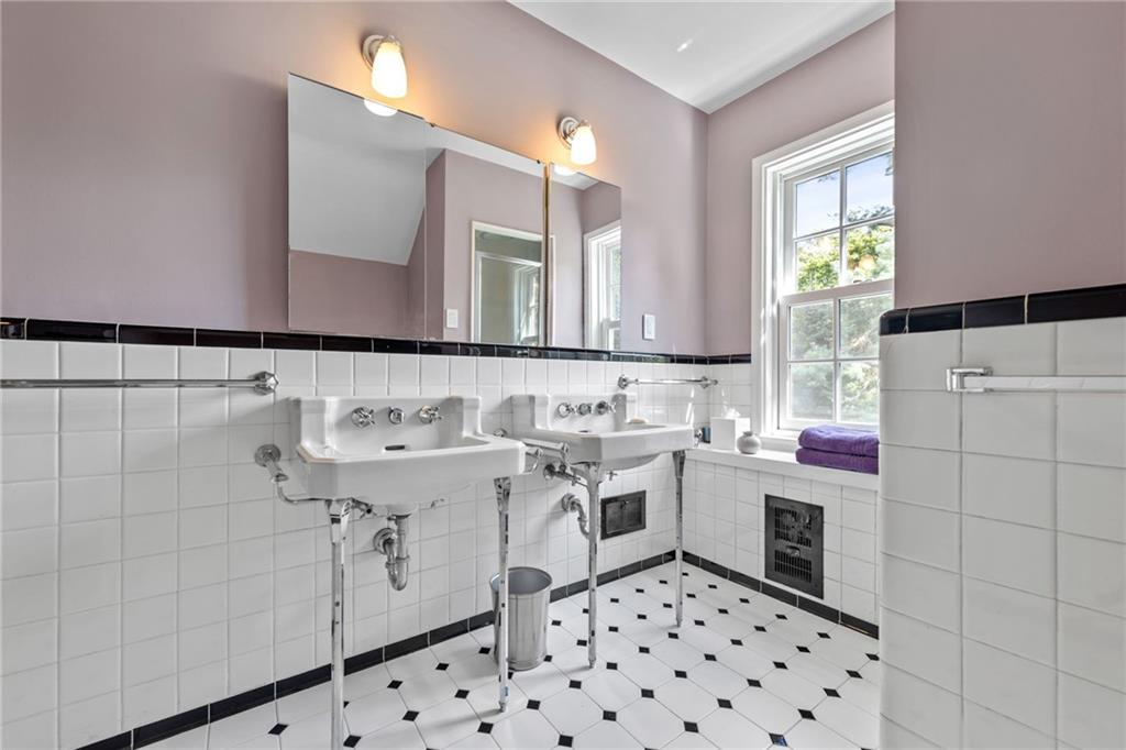 257 Scaife Road Sewickley, PA 15143 - Photo 23 of 50 a bathroom with a sink a washer and dryer