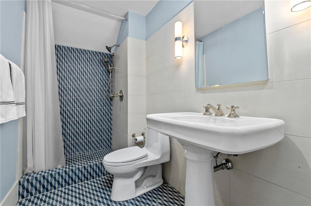 257 Scaife Road Sewickley, PA 15143 - Photo 29 of 50 a bathroom with a sink toilet and shower