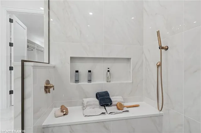 a bathroom with a tub and a shower