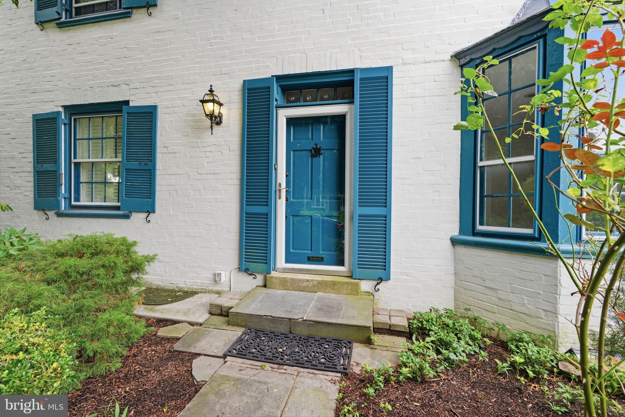 404 Old Farm Road Wyncote, PA 19095 - Photo 3 of 41 Charming entrance with vibrant blue accents.