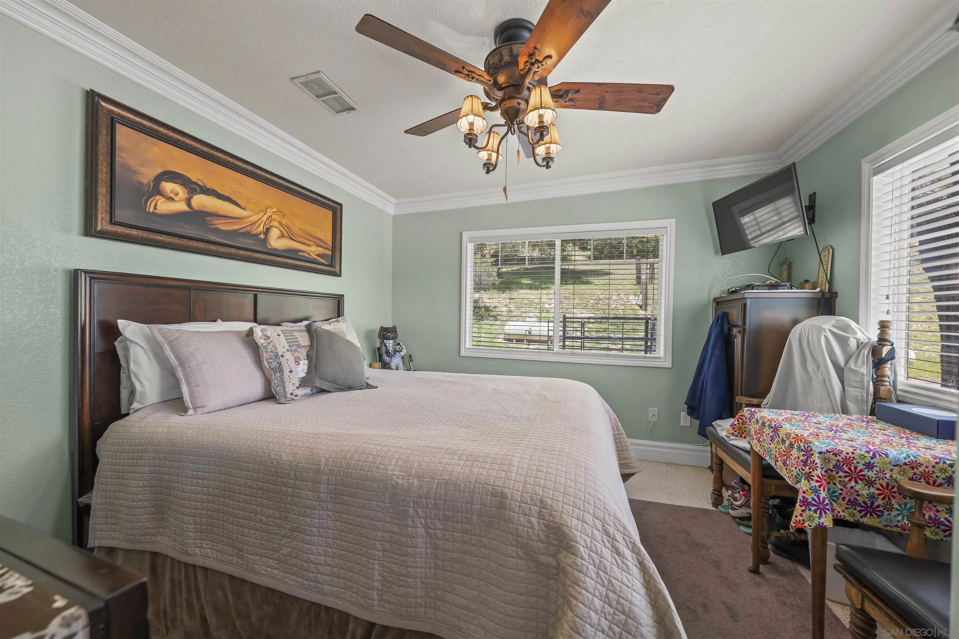 2464 Wynola Road Julian, CA 92036 - Photo 17 of 50 a bedroom with a bed chandelier and window