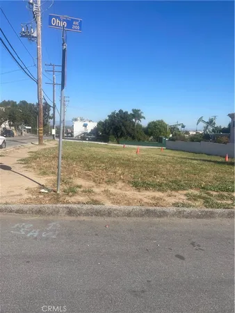 a view of a street with a building in the background