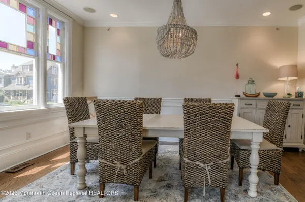 a kitchen with white cabinets sink and white appliances
