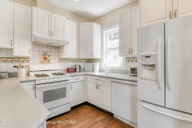 a view of a brick house with a large window