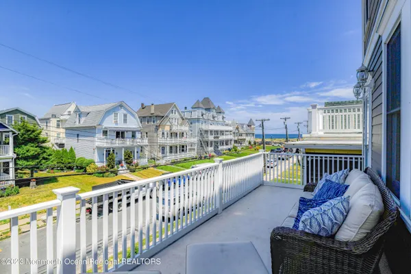 a front view of a residential apartment building with a yard