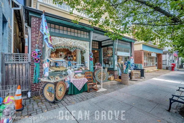 a view of a building with a street sign on a road