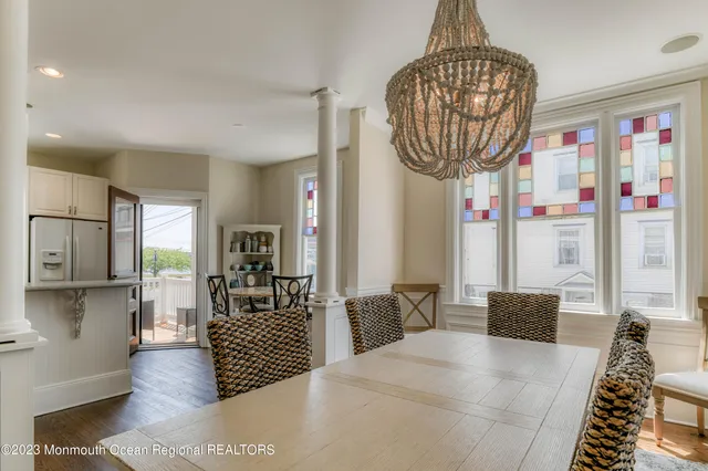 a bedroom with furniture and a chandelier
