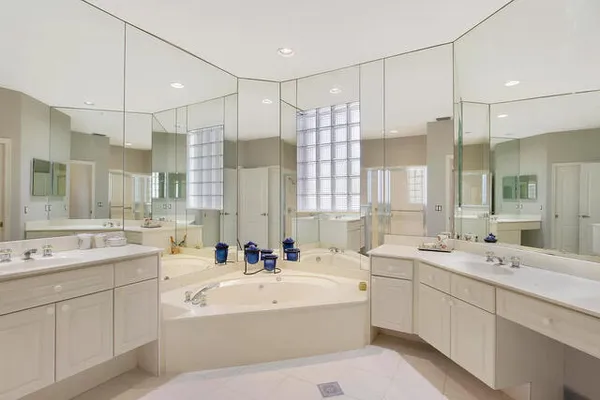 a bathroom with a double vanity sink mirror double and mirrors