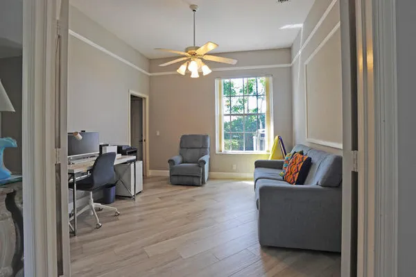 a living room with furniture and a large window